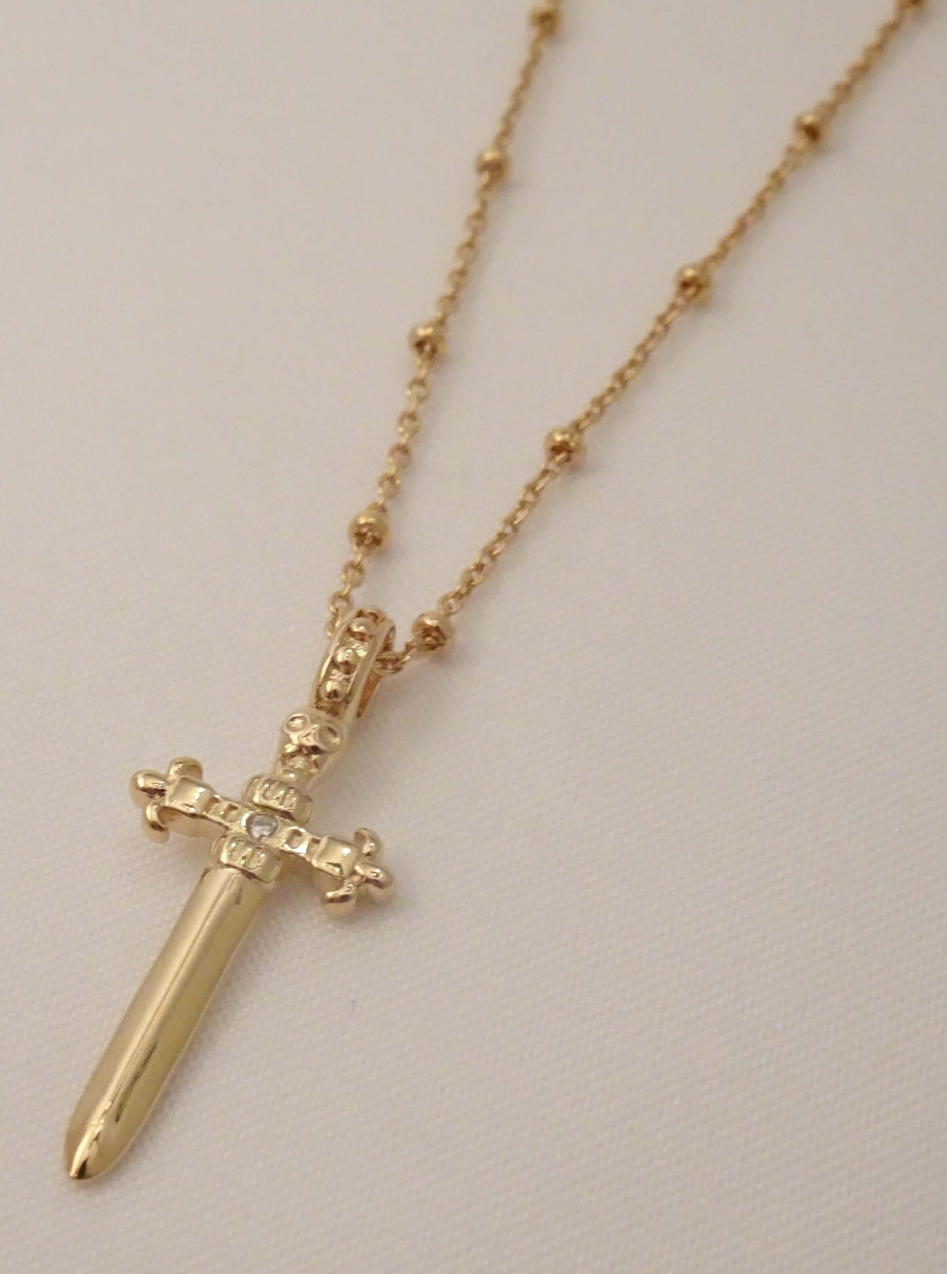 SPARROW small dagger pendant necklace, unisex men's and women's fashion jewelry, edgy minimalist necklace, punk alternative style, men's jewelry, men's necklaces, gold jewelry, trendy jewelry, statement jewelry, rebellious accessory