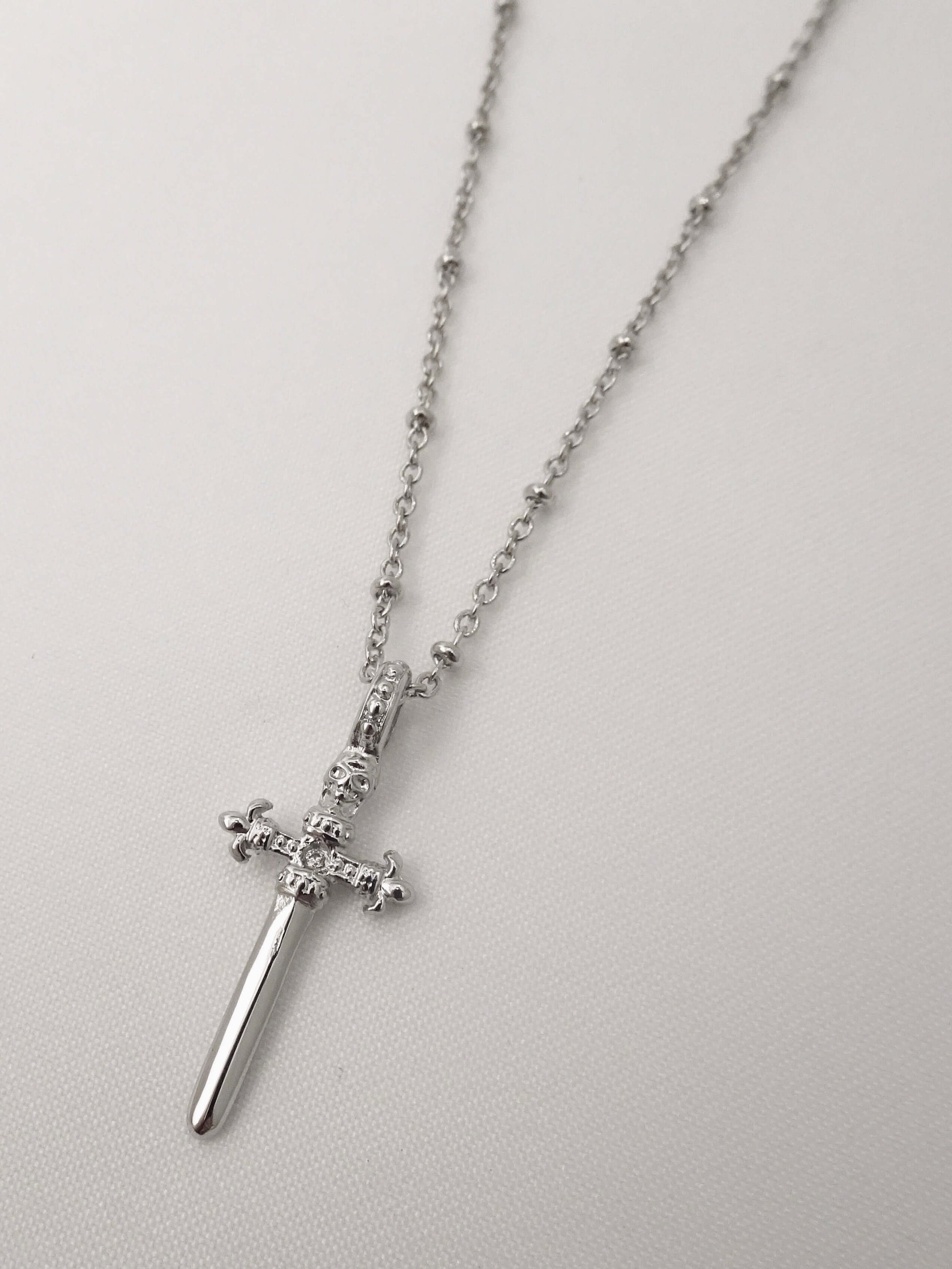 SPARROW small dagger pendant necklace, unisex men's and women's fashion jewelry, edgy minimalist necklace, punk alternative style, men's jewelry, men's necklaces, gold jewelry, trendy jewelry, statement jewelry, rebellious accessory